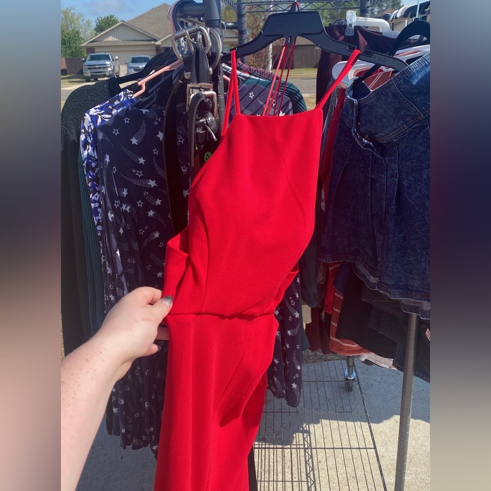 Red prom dress worn once. Still new in quality. Has a slit and open back